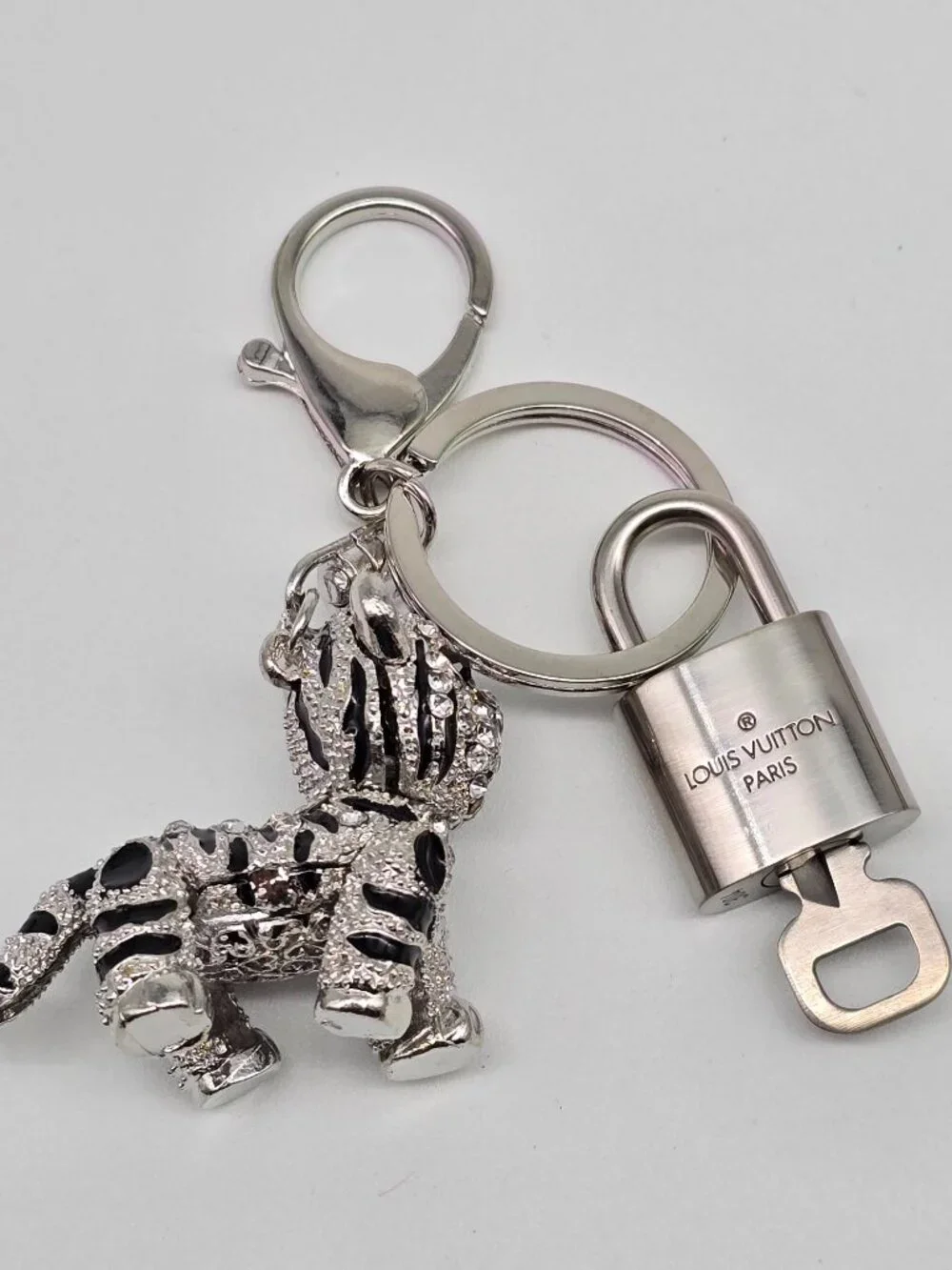 Authentic Louis Vuitton Silver Padlock with Unbranded Silver Tiger Bagcharm